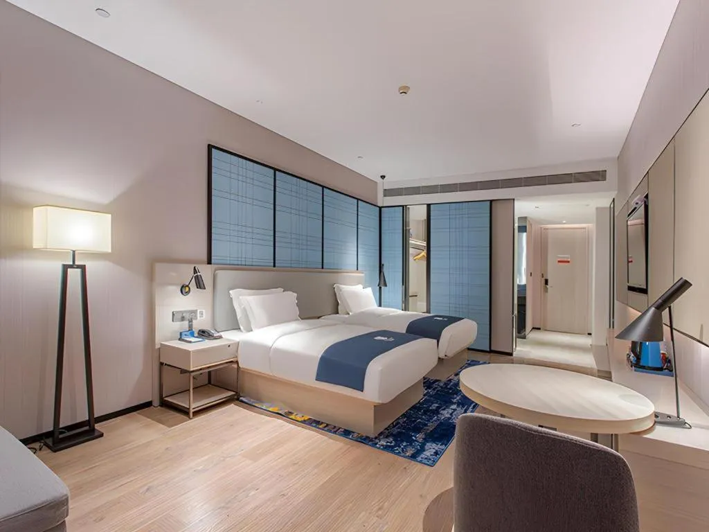 Bed in Echarm Hotel Fangchenggang Qisha