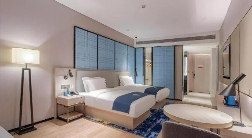 Bed in Echarm Hotel Fangchenggang Qisha