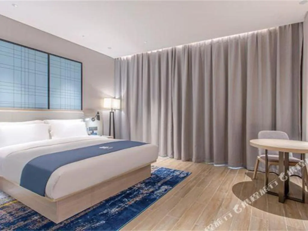 Bed in Echarm Hotel Fangchenggang Qisha