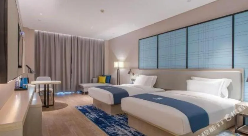 Bed in Echarm Hotel Fangchenggang Qisha