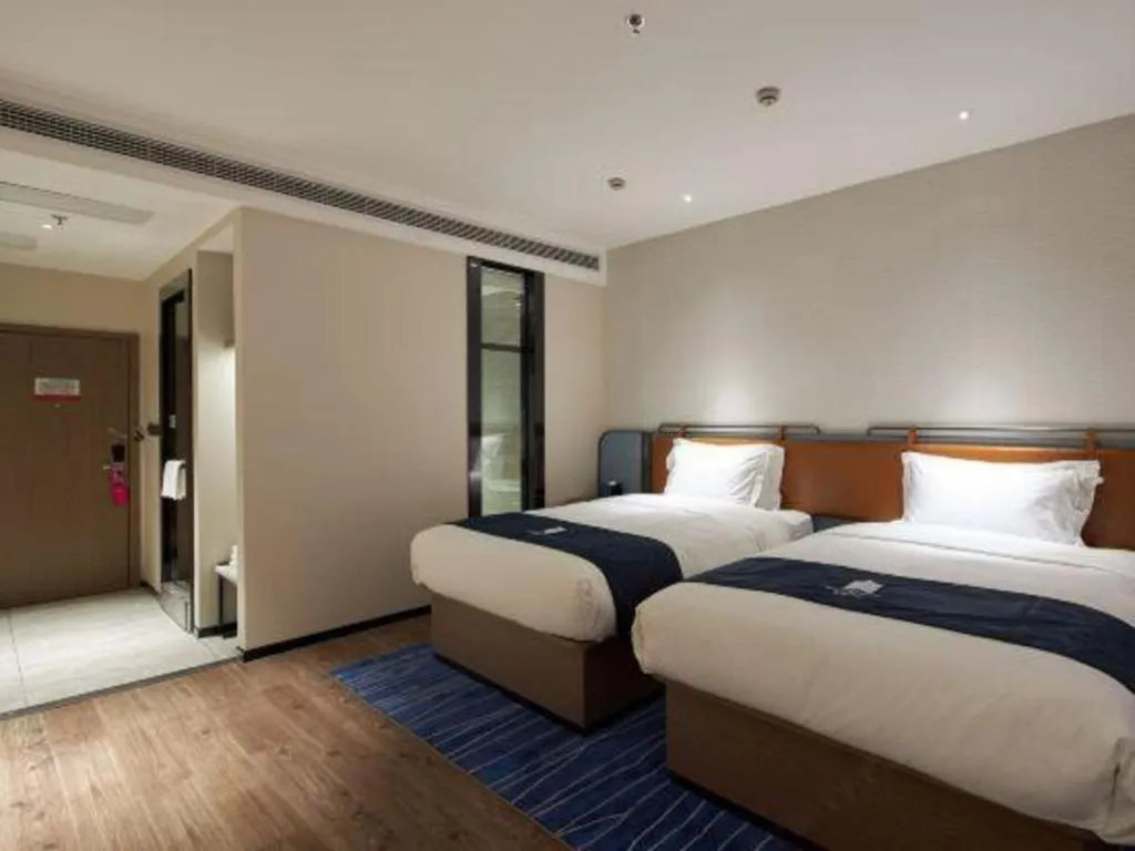 Bed in Echarm Hotel Liuzhou Yaobu Ancient Town