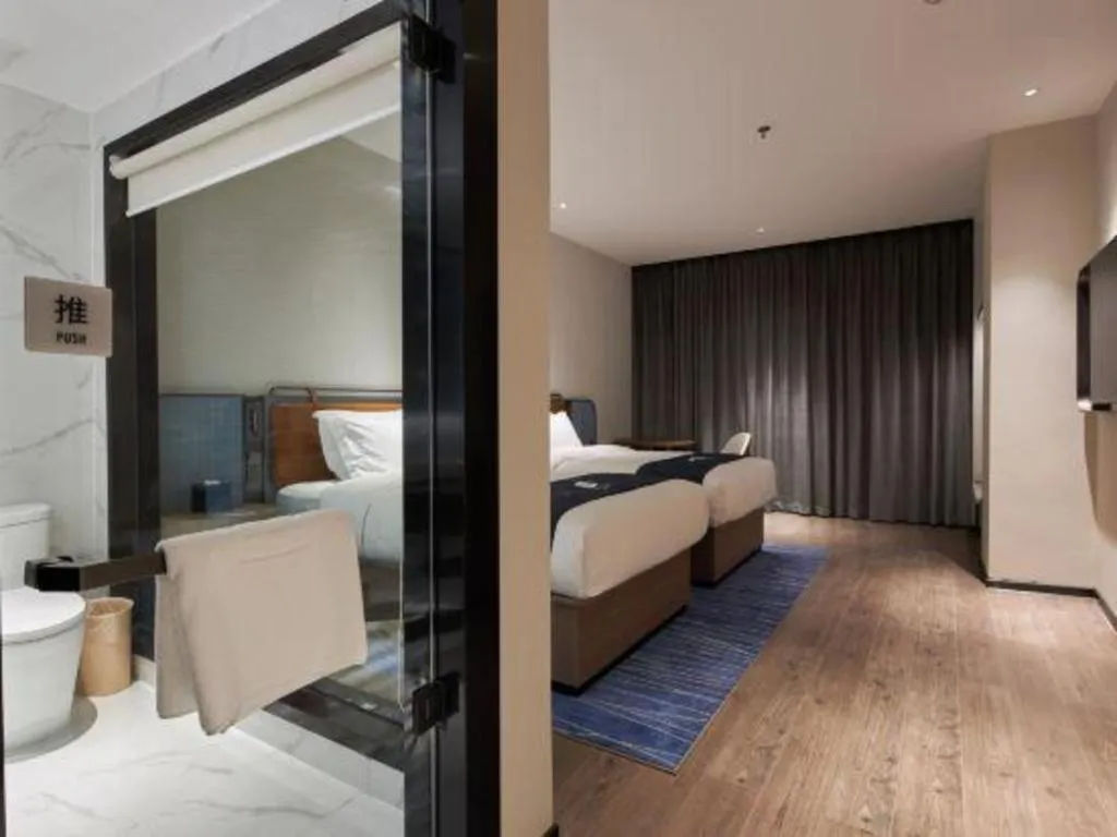 Bed in Echarm Hotel Liuzhou Yaobu Ancient Town