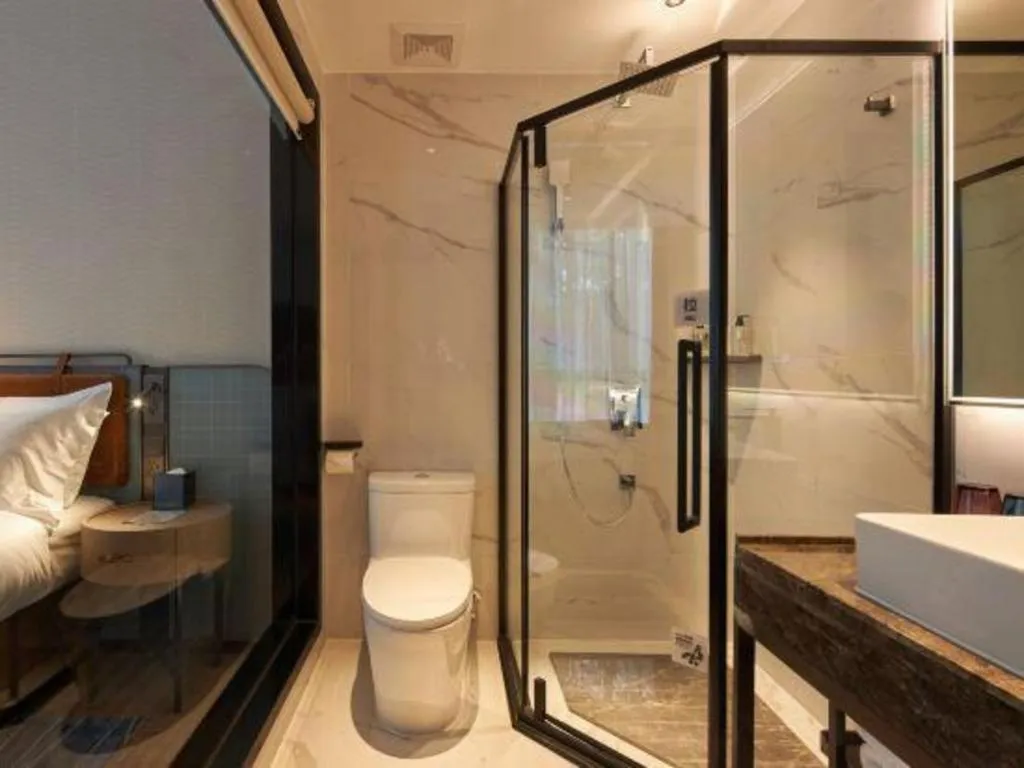 Bed in Echarm Hotel Liuzhou Yaobu Ancient Town