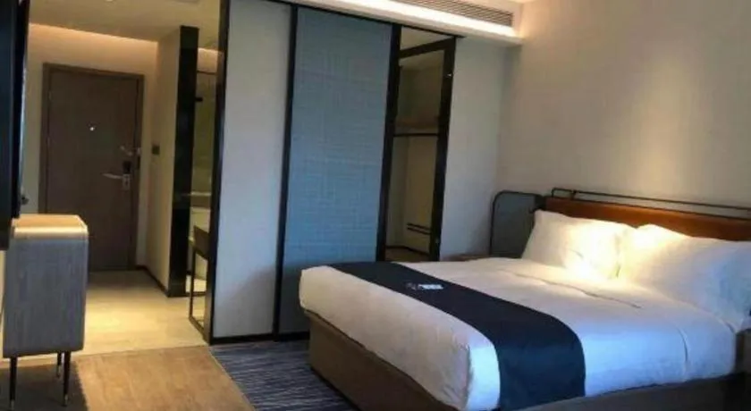 Bed in Echarm Hotel Liuzhou Yaobu Ancient Town