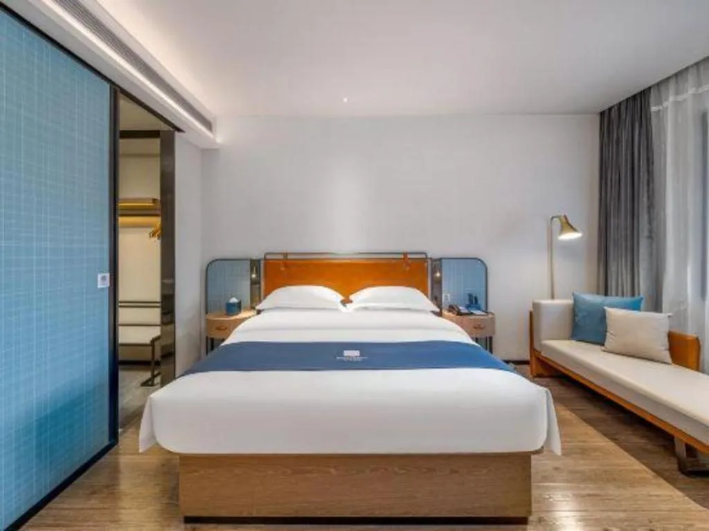 Bed in Echarm Hotel Liuzhou Yaobu Ancient Town