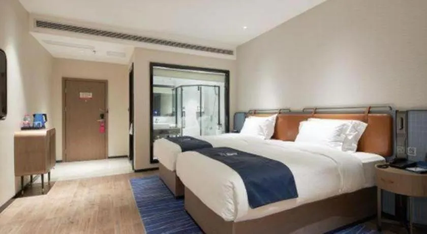 Bed in Echarm Hotel Liuzhou Yaobu Ancient Town