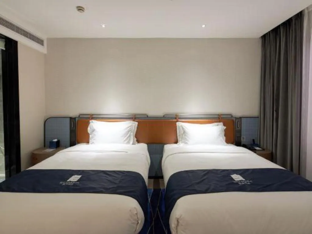 Bed in Echarm Hotel Liuzhou Yaobu Ancient Town