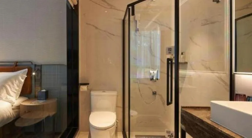 Bed in Echarm Hotel Liuzhou Yaobu Ancient Town