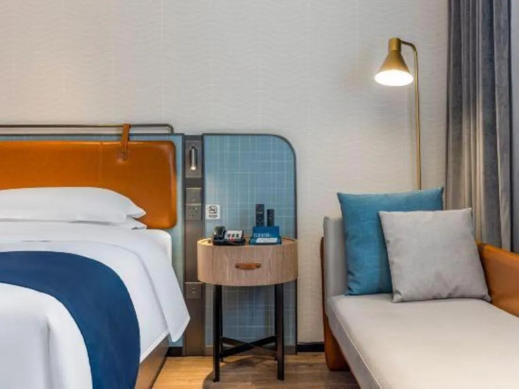 Bed in Echarm Hotel Liuzhou Yaobu Ancient Town