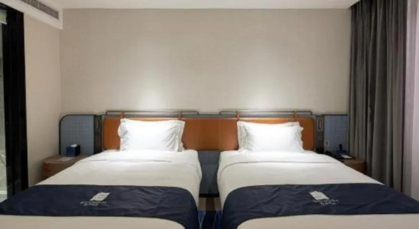 Bed in Echarm Hotel Liuzhou Yaobu Ancient Town