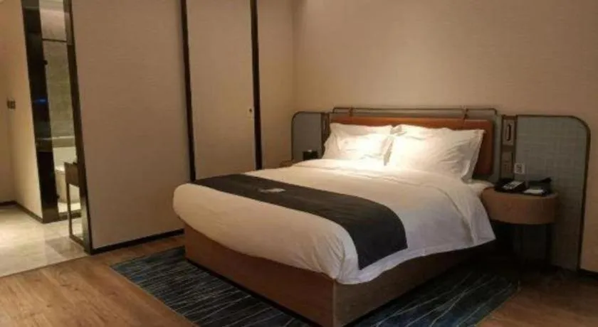Bed in Echarm Hotel Liuzhou Yaobu Ancient Town
