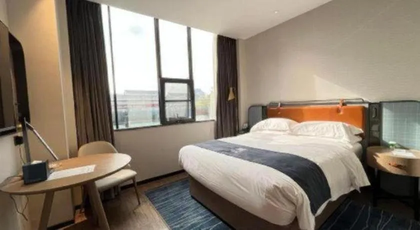 Bed in Echarm Hotel Liuzhou Yaobu Ancient Town