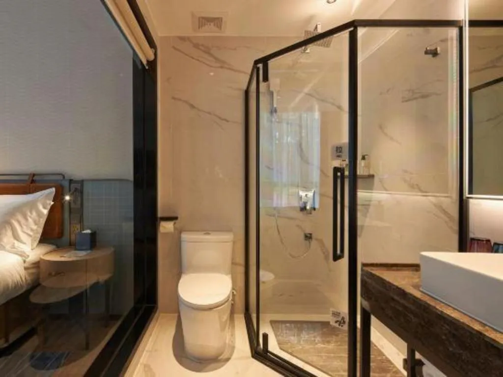 Bed in Echarm Hotel Liuzhou Yaobu Ancient Town