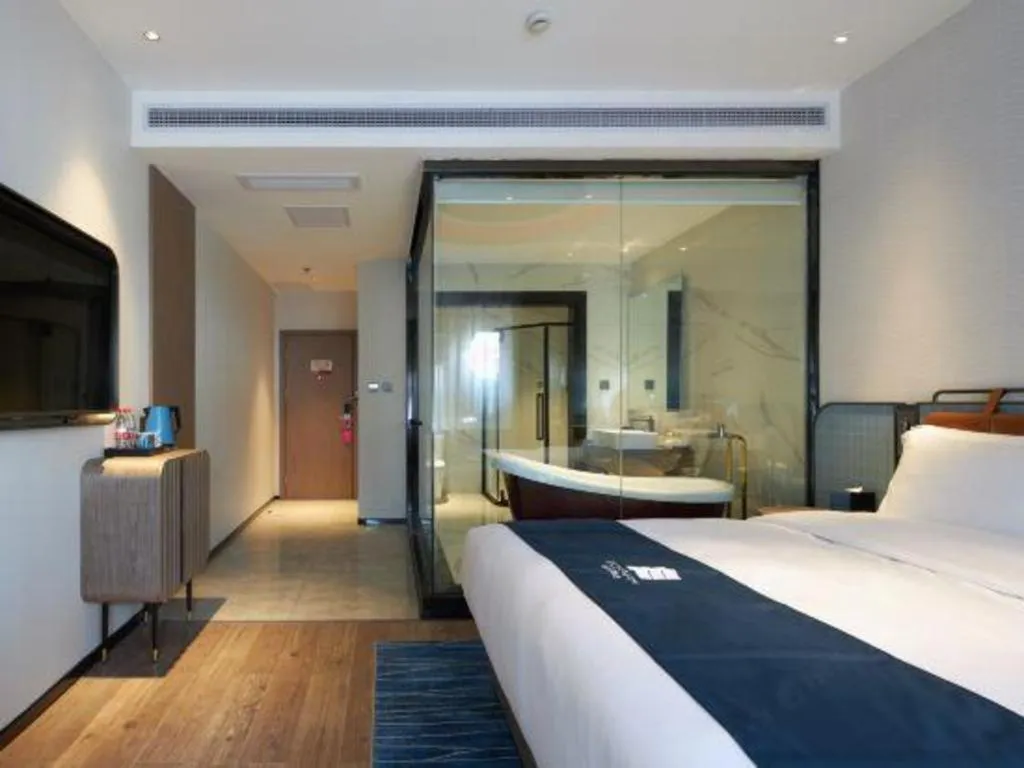 Bed in Echarm Hotel Liuzhou Yaobu Ancient Town