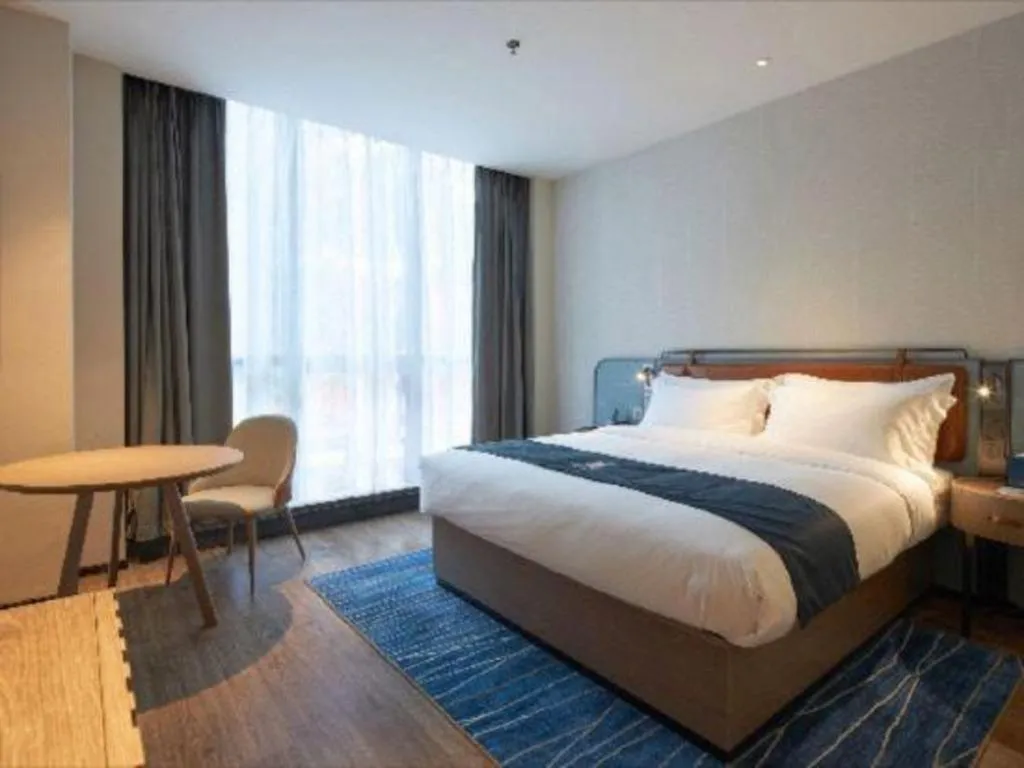 Bed in Echarm Hotel Liuzhou Yaobu Ancient Town