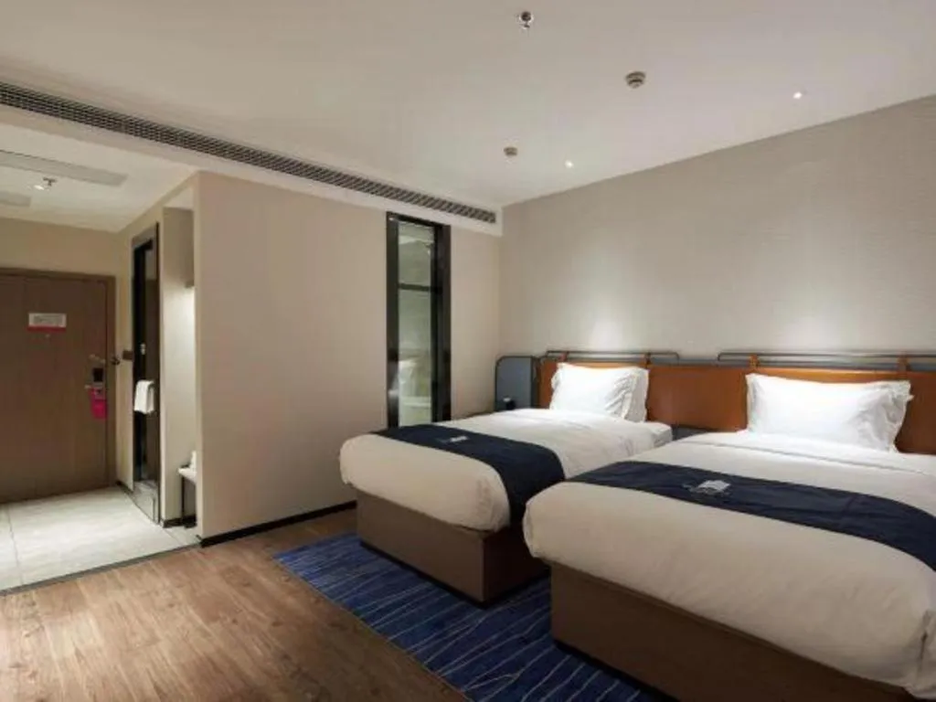 Bed in Echarm Hotel Liuzhou Yaobu Ancient Town