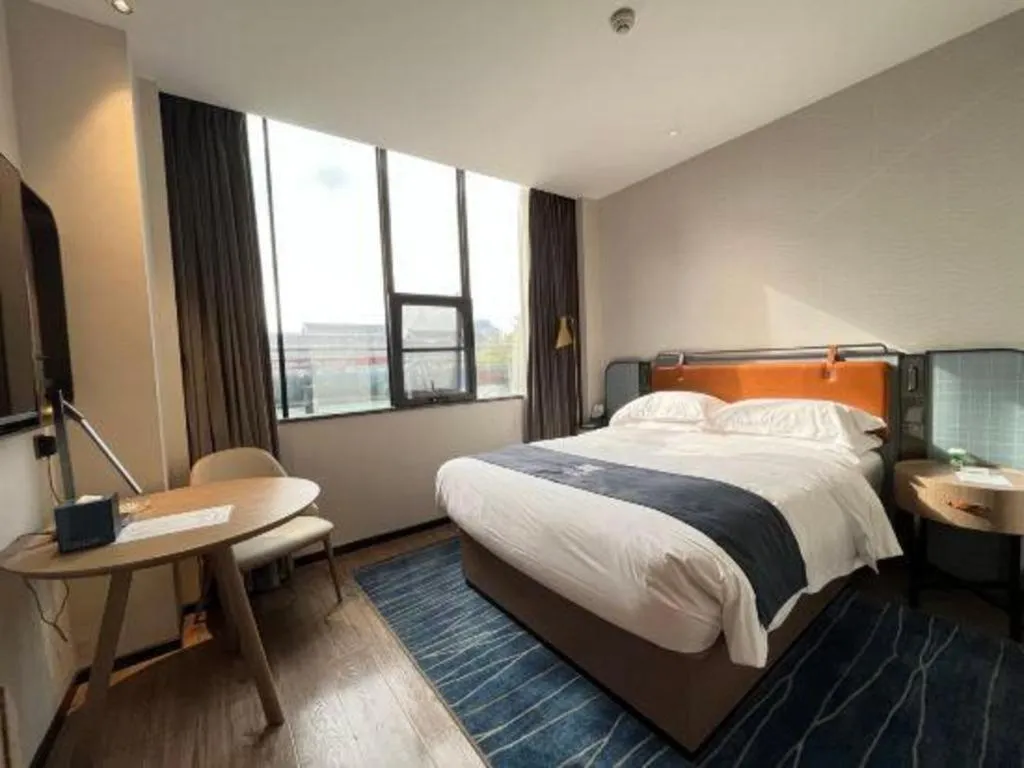 Bed in Echarm Hotel Liuzhou Yaobu Ancient Town