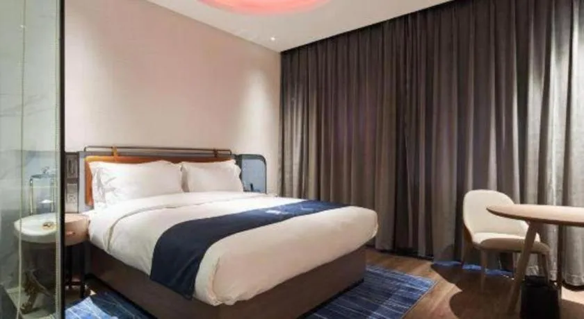 Bed in Echarm Hotel Liuzhou Yaobu Ancient Town