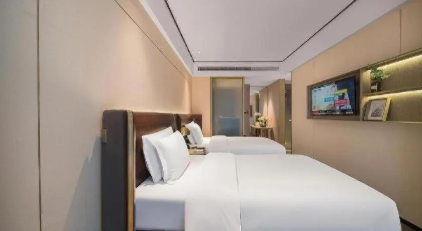 Bed in Premier City Comfort Hotel Quanzhou Wanda Plaza