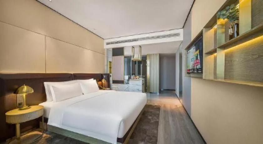 Bed in Premier City Comfort Hotel Quanzhou Wanda Plaza