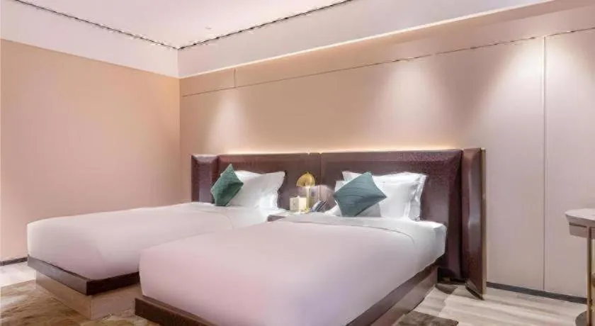 Bed in Premier City Comfort Hotel Quanzhou Wanda Plaza
