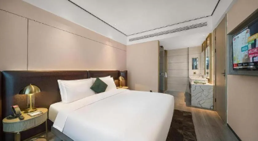 Bed in Premier City Comfort Hotel Quanzhou Wanda Plaza