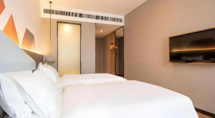 Bed in Borrman Hotel Zhonghsan Guzheng Huayi Plaza Light Rail Station