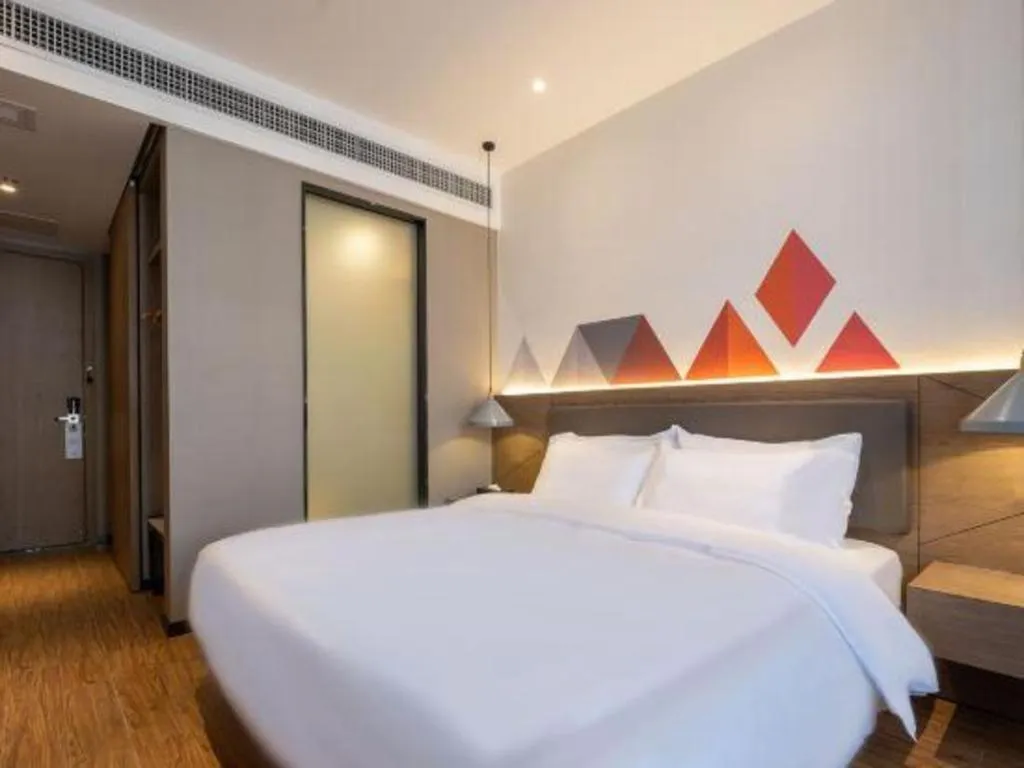 Bed in Borrman Hotel Zhonghsan Guzheng Huayi Plaza Light Rail Station