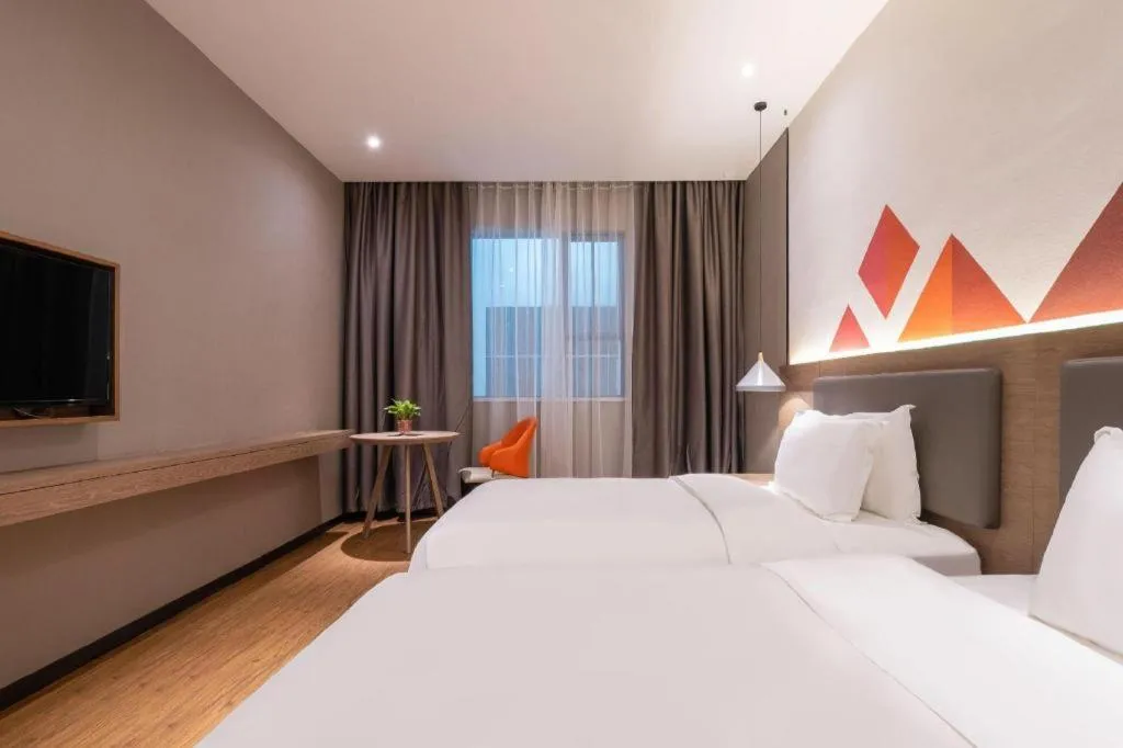 Bed in Borrman Hotel Zhonghsan Guzheng Huayi Plaza Light Rail Station