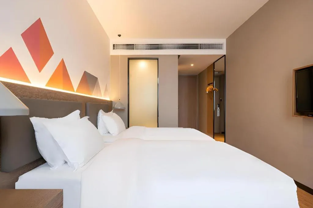Bed in Borrman Hotel Zhonghsan Guzheng Huayi Plaza Light Rail Station