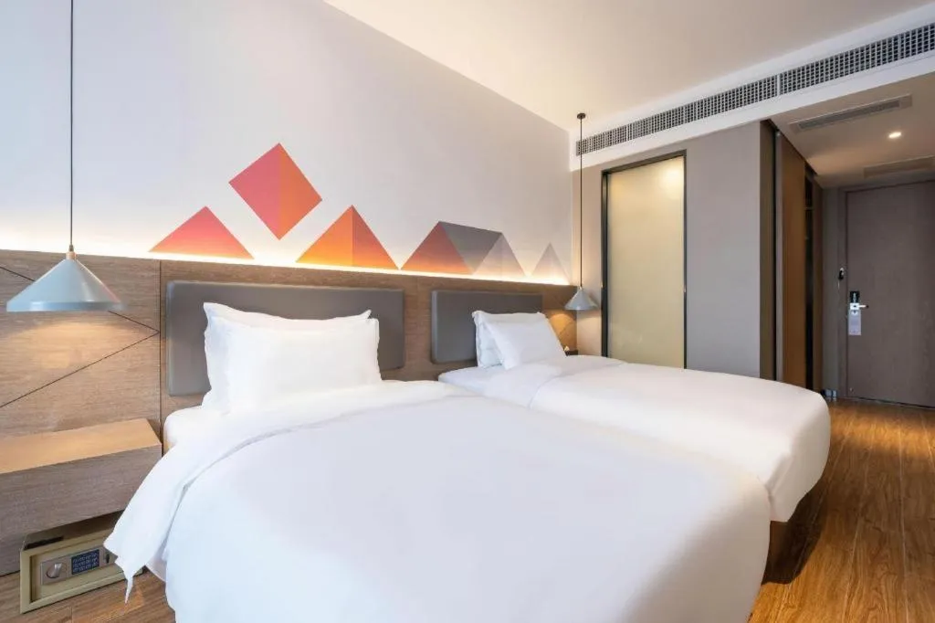 Bed in Borrman Hotel Zhonghsan Guzheng Huayi Plaza Light Rail Station