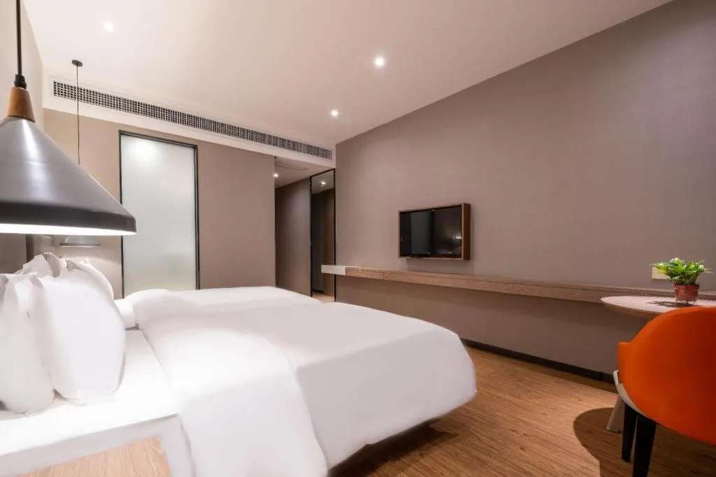 Bed in Borrman Hotel Zhonghsan Guzheng Huayi Plaza Light Rail Station