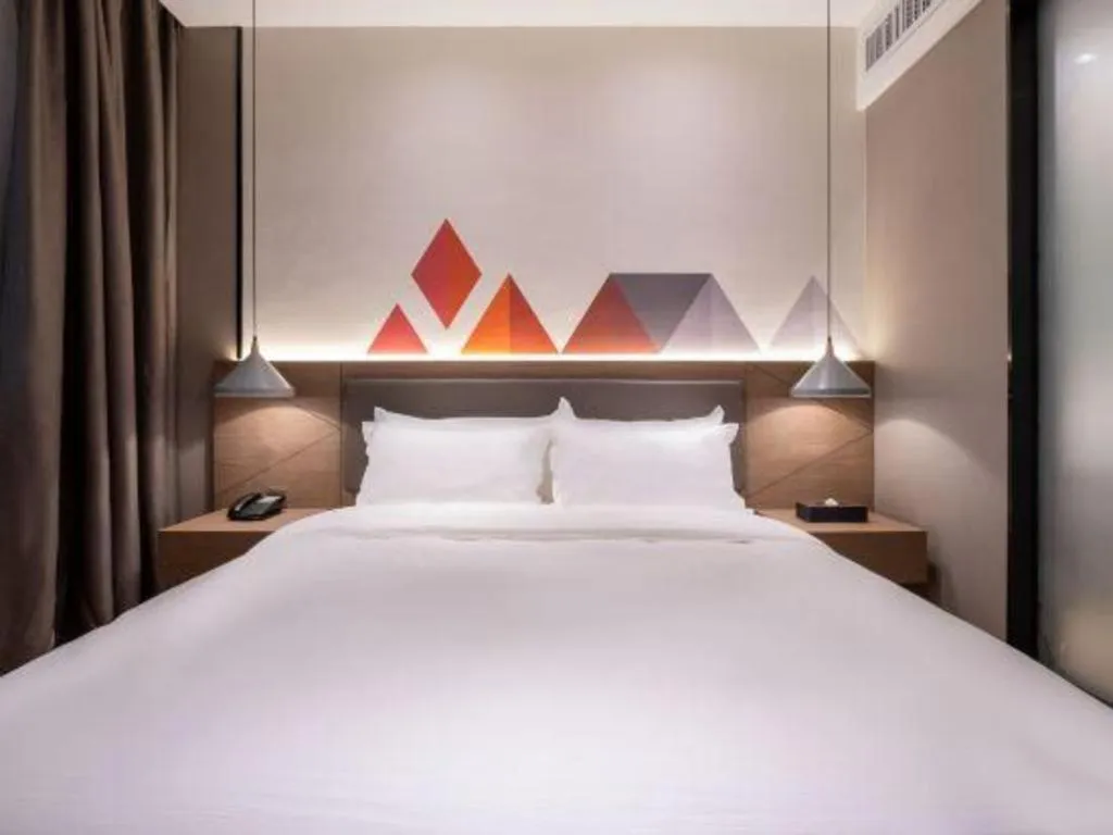 Bed in Borrman Hotel Zhonghsan Guzheng Huayi Plaza Light Rail Station