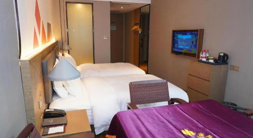 Bed in Borrman Hotel Zhonghsan Guzheng Huayi Plaza Light Rail Station