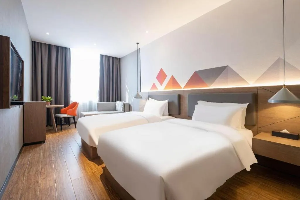 Bed in Borrman Hotel Zhonghsan Guzheng Huayi Plaza Light Rail Station