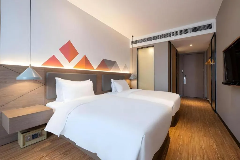 Bed in Borrman Hotel Zhonghsan Guzheng Huayi Plaza Light Rail Station