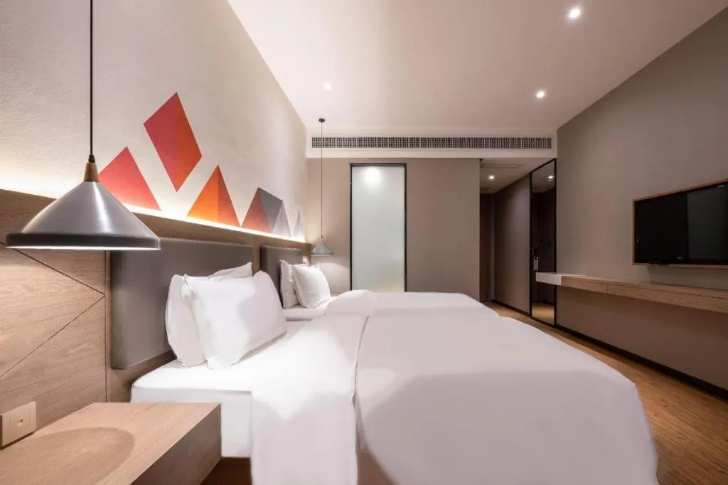 Bed in Borrman Hotel Zhonghsan Guzheng Huayi Plaza Light Rail Station