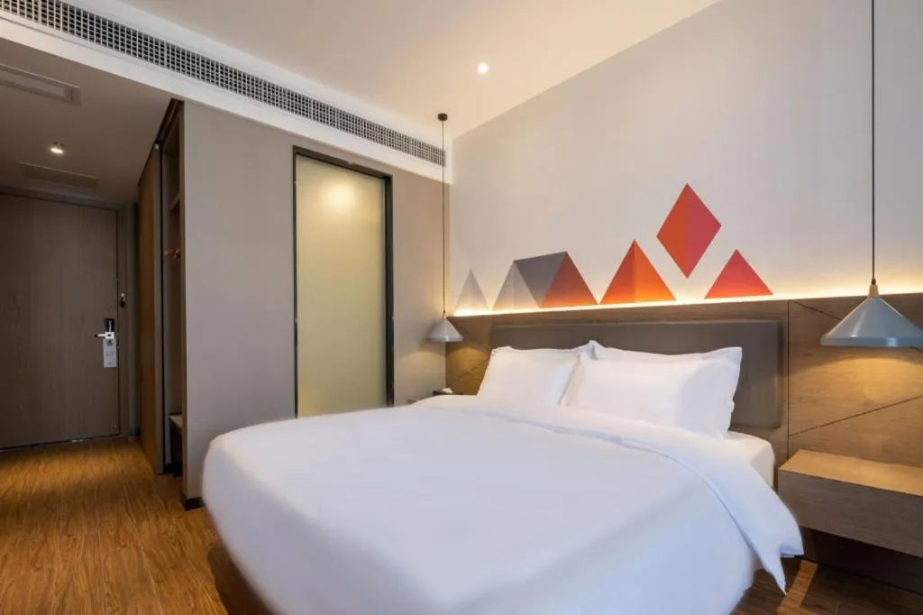 Bed in Borrman Hotel Zhonghsan Guzheng Huayi Plaza Light Rail Station