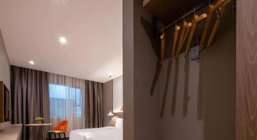 Bed in Borrman Hotel Zhonghsan Guzheng Huayi Plaza Light Rail Station
