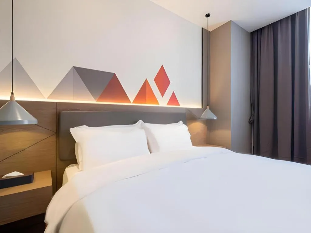 Bed in Borrman Hotel Zhonghsan Guzheng Huayi Plaza Light Rail Station