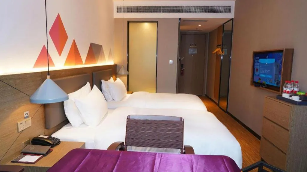 Bed in Borrman Hotel Zhonghsan Guzheng Huayi Plaza Light Rail Station