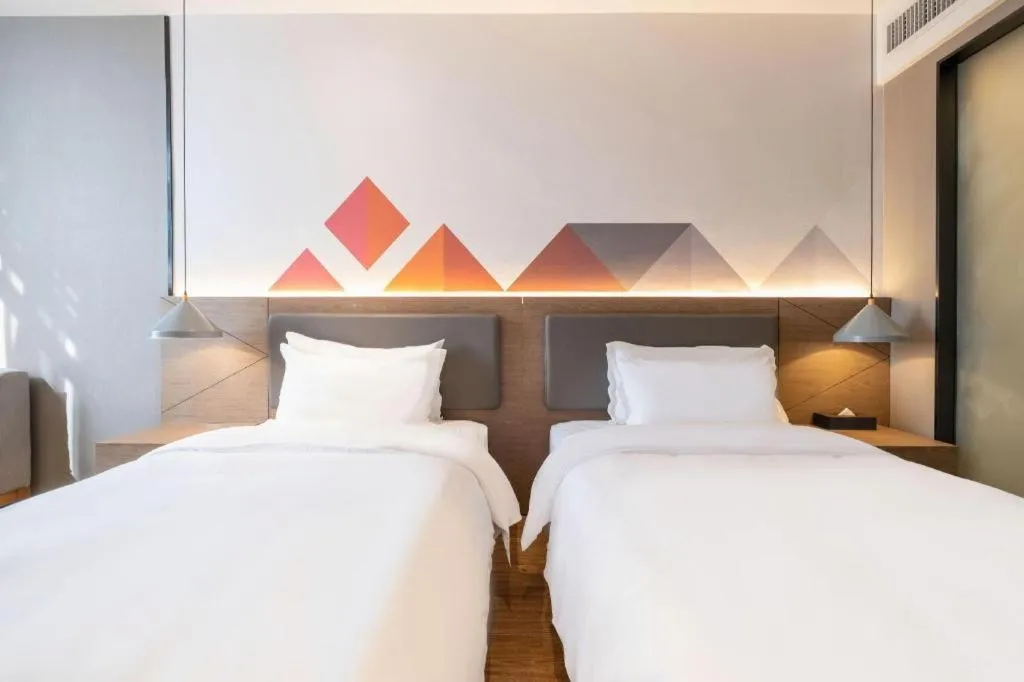 Bed in Borrman Hotel Zhonghsan Guzheng Huayi Plaza Light Rail Station