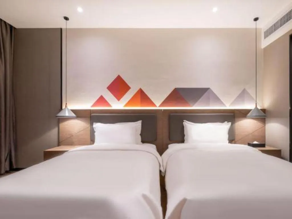 Bed in Borrman Hotel Zhonghsan Guzheng Huayi Plaza Light Rail Station