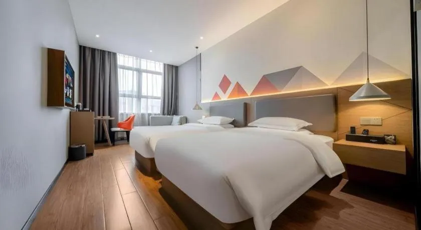 Bed in Borrman Hotel Zhonghsan Guzheng Huayi Plaza Light Rail Station