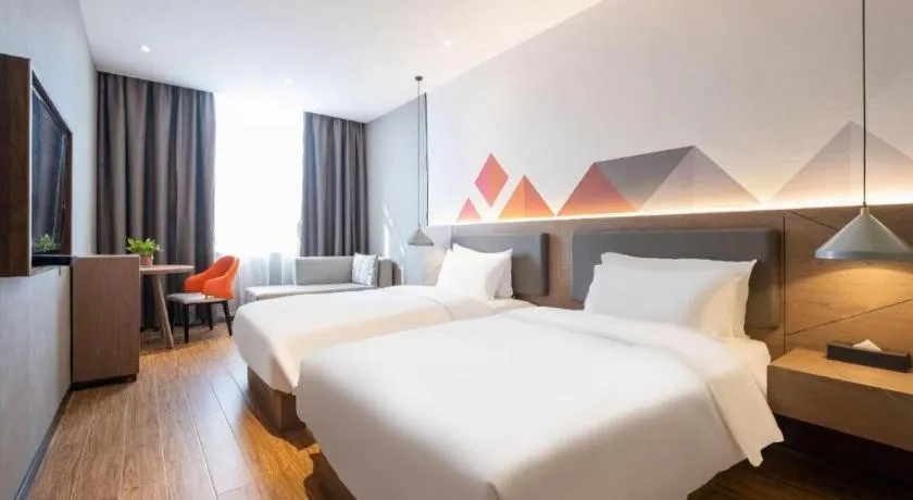 Bed in Borrman Hotel Zhonghsan Guzheng Huayi Plaza Light Rail Station