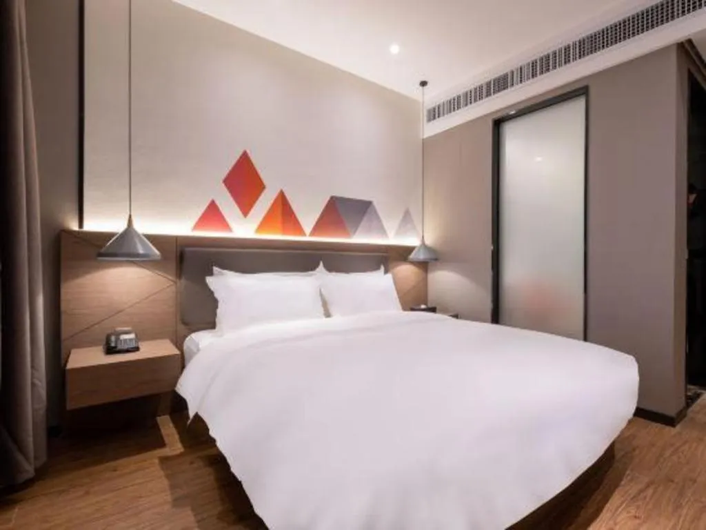 Bed in Borrman Hotel Zhonghsan Guzheng Huayi Plaza Light Rail Station