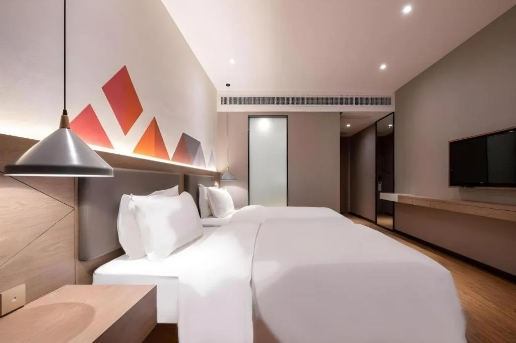 Bed in Borrman Hotel Zhonghsan Guzheng Huayi Plaza Light Rail Station