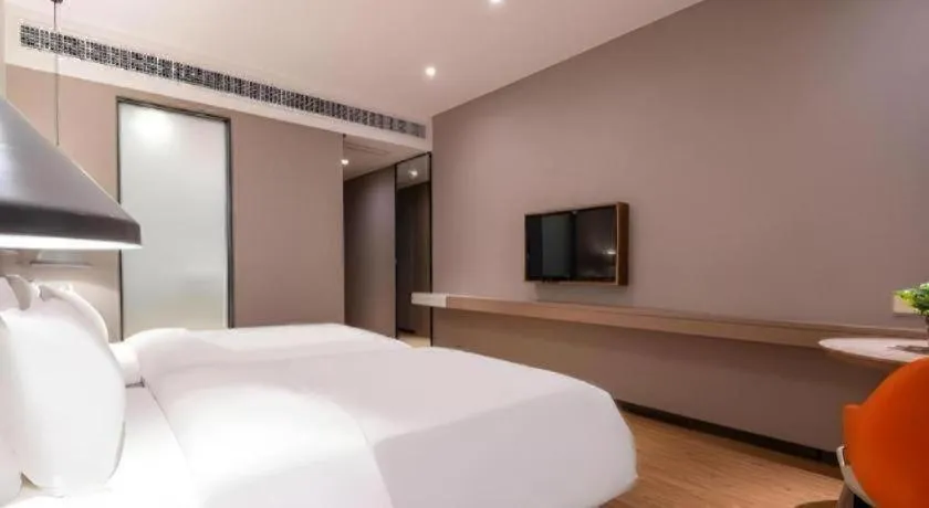 Bed in Borrman Hotel Zhonghsan Guzheng Huayi Plaza Light Rail Station