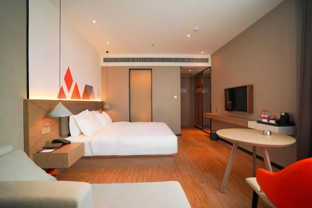 Bed in Borrman Hotel Zhonghsan Guzheng Huayi Plaza Light Rail Station