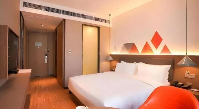 Bed in Borrman Hotel Zhonghsan Guzheng Huayi Plaza Light Rail Station